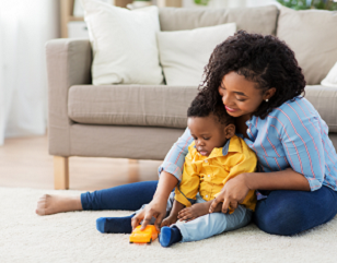 Child and adult playing on the floor