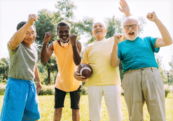 Four older gentleman enjoying sports outdoors.