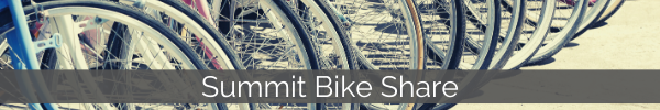 Image of many bicycles lined up. Links to Summit Bike Share page.